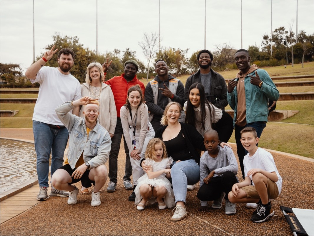 The whole team and their families together on location