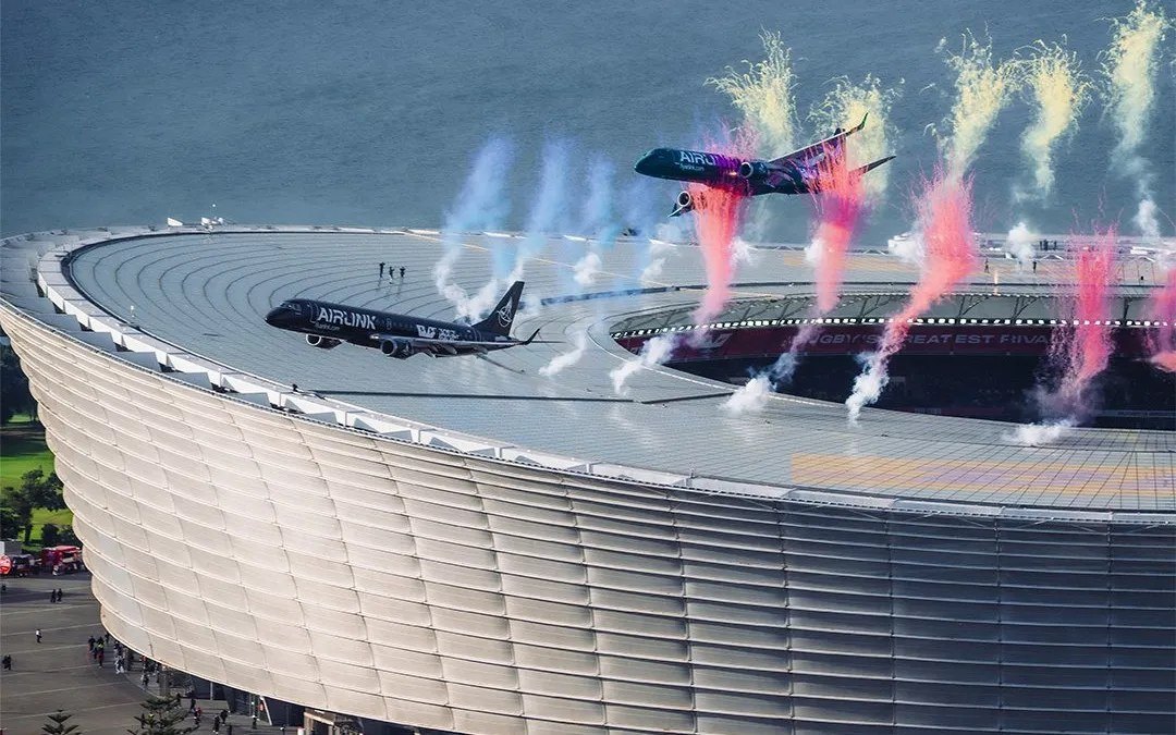 Two Airlink jets passing low over DHL Stadium in Cape Town